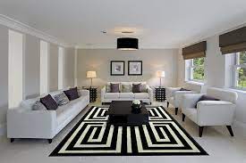 Discover design inspiration from a variety of living rooms, including color, decor and storage the library end of the great room includes a black nero marble fireplace surround. Black And White Living Rooms Design Ideas