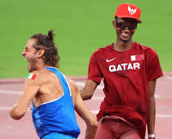 Gold medalist mutaz barshim, left, of qatar and silver medalist gianmarco tamberi of italy celebrate on the track after the final of the men's high jump at the 2020 summer olympics, sunday, aug. Xdd0nci Kmljvm