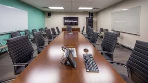 Mentor presenting charts and reports, employees meeting at business training, seminar or conference. Cma 5 130 Rtf Conference Room Moody College Of Communication
