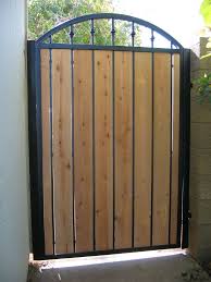 Iron Gates W Wood Fencing Around You Wood Gate Iron Garden Gates House Gate Design