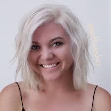 Medium length hairstyles for fine hair. Platinum Blonde Layered Bob With Wavy Texture And Long Side Swept Bangs The Latest Hairstyles For Men And Women 2020 Hairstyleology