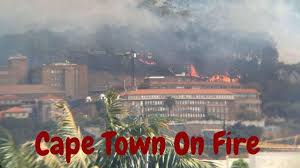 Runs past a burning barricade during a protest against the lack of policing in masiphumelele, cape town, south africa on tuesday. T7lnxayffc Gnm
