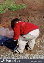 Kids pants fall down in front of the whole school. Image Of Little Boy Playing In Mud