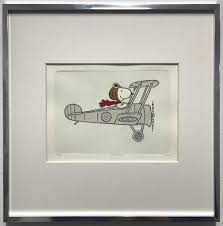 In the peanuts comic strip, snoopy pretends his doghouse is a sopwith camel, and pretends to fight the red baron with it. Snoopy Sopwith Camel Gerahmt Galerie Hunold