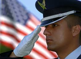 US Air Force (USAF) STAFF Sergeant (SSGT) Brian Contreras, Team Leader,  314th Airlift Wing (AW) Honor Guard, renders a salute during a retreat  ceremony honoring the former US President Ronald Wilson Reagan.