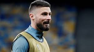 The striker wears a fancy wet hairstyle. Olivier Giroud Will Get More Minutes In The Premier League