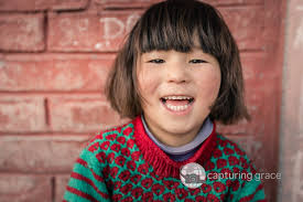 Capturing Grace: Realtor And Humanitarian Photographer Ronnie Mosley Shares  Stories From Ukraine And Beyond