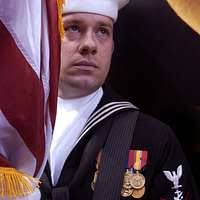 Newly promoted Warrant Officer Robert A. Herrin, receives