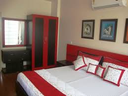 Blue walls with soft, fluffy clouds give the illusion that a. Red And Black Bedroom Homifind
