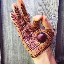 Henna is a type of plant with a natural staining ability. Henna Is Never Black But With Thorough Aftercare Henna Stains Will Darken To The Color Of Black Cherry On The Palm Henna Tattoo Designs Henna Stain Henna