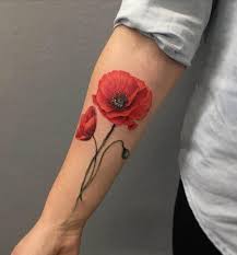 It is a black and gray piece that has a lot of detail. 20 August Birth Flower Tattoo Ideas For Females Entertainmentmesh