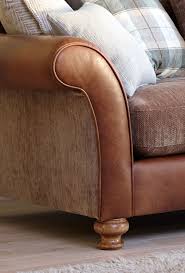 A leather sofa can lend a certain elegance to a room that is hard to duplicate in a fabric. Alexander James Lawrence We Love The Combination Of Fabric Leather And Checked Print Sofa Reupholstery Cushions On Sofa Best Leather Sofa