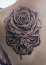 People often get a black rose tattoo engraved on them to remember their loved ones, who are no more. Shoulder Skull Rose Tattoo By Dragstrip Tattoos