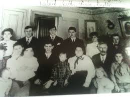 The Ramsey Family. Pictured below is John and Patsy Ramey, seated with  their two young children Jonbenet and Burke. | Facebook