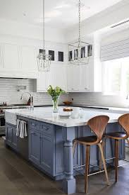 Maximize your kitchen space by following these plans for how to build a kitchen island with room to do it all—chop, mix, shelve, and store. Large Blue Kitchen Island With Blue Turned Legs Transitional Kitchen