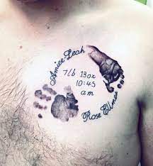Other ingredients have been mingled with this hand print tattoo to make it unique. 60 Handprint Tattoo Designs For Men Impression Ink Ideas Cool Mens Baby Birthday Handprint Upper Chest Tattoo Tattoo For Son Baby Feet Tattoos Baby Tattoos