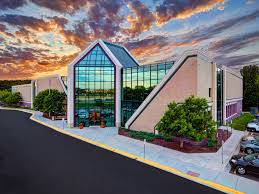 Enjoy indoor and outdoor tennis courts. Lifetime Fitness Interior Concierges Desk Architectural Photo
