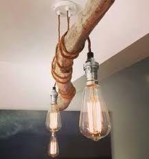 Hanging from a 48 in chain, this light is perfect above any living room, dining room, or foyer. 46 Driftwood Lighting Ideas In 2021 Driftwood Driftwood Lamp Driftwood Chandelier