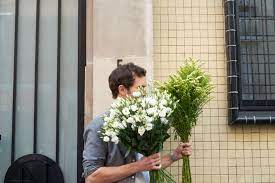 The Making Of A Beautiful Bouquet Fresh Bundles Of Goldenrod And White Lisianthus Same Day Flower Delivery Flower Delivery Beautiful Bouquet