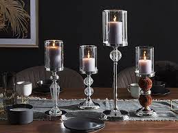 Candles are perfect for helping you create a warm, cosy setting, and with the help of something as simple as a tea light in a glass tea light holder, it's easy to quickly make a big impact that will wow your guests. Hurricane Candle Holder 42 Cm Silver Bonao Beliani Co Uk