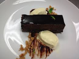 Chocolate X 3 Chocolate Brownie Base Dark Chocolate Mousse Chocolate Glaze Served With Vanil Peanut Butter Crunch Dark Chocolate Mousse Chocolate Brownies