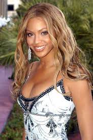 Beyoncé smiles with a flower in her hair during 2001 mtv movie awards at shrine auditorium in los angeles, california. 48 Beyonce Hairstyles Through The Years