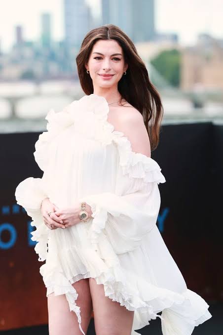 Anne Hathaway Is Literally Dripping in Ruffles as She Shows Off Her Baby Bump in the Dreamiest Boho White Minidress - AOL