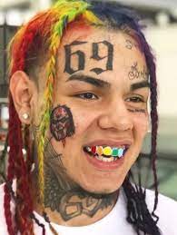 He has a knife tattoo on his forehead. Top 10 Famous Rappers With Face Tattoos Tattoo Me Now