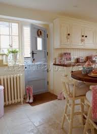 Cream Sunlit Country Kitchen With Pink Accessories And Pastel Blue Back Door I Could Faint Country Kitchen Country Kitchen Accessories Eclectic Kitchen