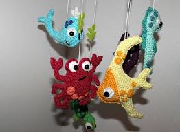 There is a real fish hook in the center of the mobile but the hook part is encased in clear plastic. Fish And Co Nursery Mobile Crochet Pattern