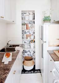 Open Shelves With Wallpaper Behind Erin Chow S Bright White Alcove Studio In Vancouver Rue Pantry Wallpaper Apartment Kitchen Wallpaper Shelves