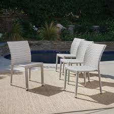 Noble House Lucian Chateau Grey Stackable Armless Wicker Outdoor Dining Chair 4 Pack 42227 The Home Depot In 2020 Patio Chairs Outdoor Dining Chairs Patio Dining Chairs