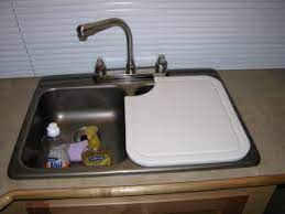 Create a sophisticated sink design with a vigo stainless steel finished soap dispenser. Kitchen Sinks Designer Luxury Kitchen Sinks Kitchen Sink Board Cover