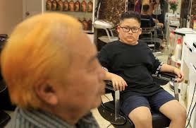 Kim or Trump? Hanoi barber offers leaders' hairdos for free