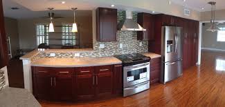Your small kitchen space can be designed to include these elegant, dark wood elements. Kitchen Design Ideas Stone International Shaker Cabinets