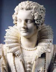 Oltre all'eleganza del pizzo scolpito con maestria, spicca in basso a  destra una grande ape in marmo: simbolo della famiglia Barberini. Piccole  api decorative completano il dettaglio. L'opera è “Maria Duglioli Barberini”