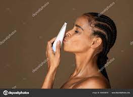 Beautiful Black Woman Perfect Pure Skin Kissing Tube Cream Isolated Stock  Photo by ©Milkos 650638416