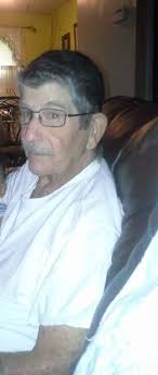 What is the history of the old barber shop at Heritage Park in Adrian MI?