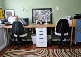 This workstation accommodates two people with two desks, both of which feature steel frames and laminate tabletops. 12 Two Person Desk Ideas Two Person Desk Desk Design Home Office Furniture