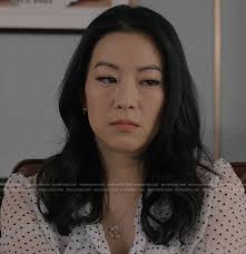 WornOnTV: Ingrid's polka dot blouse, pinstripe skirt, and white coat