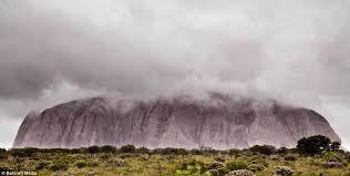 A rare wonder of nature. Ayer S Rock Pictured In Rare Storm As Half A Year S Rain Falls In One Day Daily Mail Online