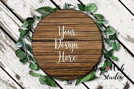 Flat Lay Wood Sign Mockup Round Wood Sign On Leaf Wreath 250703 Decorative Design Bundles Round Wood Sign Sign Mockup Wood Signs
