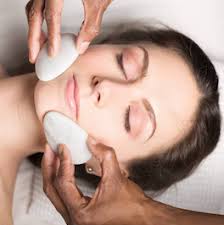 Cryofacial balancing involves smoothing the cold stones over the face to cool and soothe irritated skin. Facebook