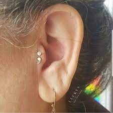 This Tragus Piercing Trend Is All Over Instagram And You Ll Wanna Double Down Tragus Piercing Earrings Unique Ear Piercings Pretty Ear Piercings