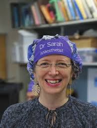 Retired Surgeon Bill Sugrue and former nurse of 50 years Helen Brown cut  the birthday cake