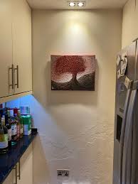 Does hanging up leaning pictures count as decluttering?