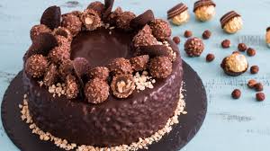 What An Amazing Cake To Make If You Want To Impress This Ferrero Rocher Cake Has It All I Think Great To Make For T Ferrero Rocher Cake Cake Nutella Frosting