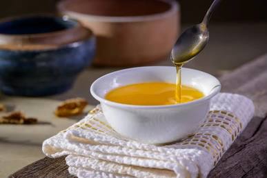 Pure ghee acts as a warming Ayurvedic superfood during cold winter months, AI generated