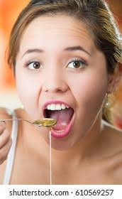 Young Woman Facing Camera Holding Spoon Stock Photo 610569257