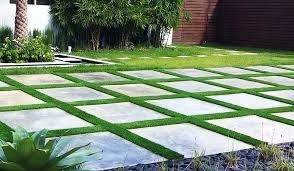 Gray stone pavers with grass or artificial grass. Artificial Grass Between Pavers Everything You Need To Know